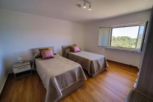 A bed or beds in a room at San Martino Holiday Apartments