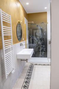 a bathroom with a sink and a shower at Dimora delle Storie in Tempio Pausania +13 photos