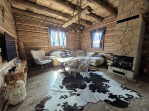 a living room with a couch and a table at Drevenička Zázrivá Terchová in Zázrivá