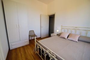 A bed or beds in a room at San Martino Holiday Apartments