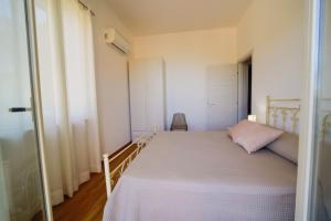 A bed or beds in a room at San Martino Holiday Apartments