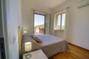A bed or beds in a room at San Martino Holiday Apartments