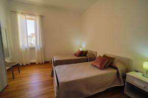 A bed or beds in a room at San Martino Holiday Apartments