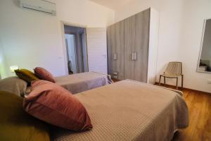 A bed or beds in a room at San Martino Holiday Apartments