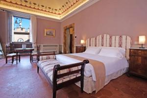 Voodi või voodid majutusasutuse Delcorto Suites toas