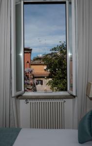 Letto o letti in una camera di AGH Babuino