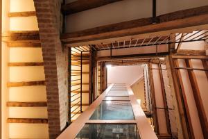 an indoor swimming pool in the middle of a building at Kallisté in Ajaccio