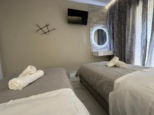 Postel nebo postele na pokoji v ubytování Evelina Luxury Suites in Corfu