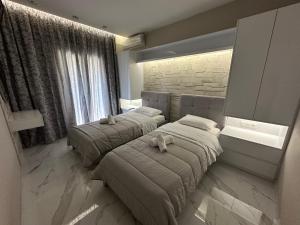 Postel nebo postele na pokoji v ubytování Evelina Luxury Suites in Corfu