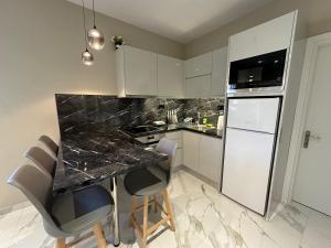 Kuchyň nebo kuchyňský kout v ubytování Evelina Luxury Suites in Corfu