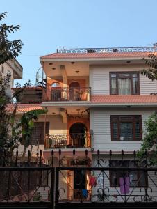 a house with a fence in front of it at Gyanman Homes in Kathmandu