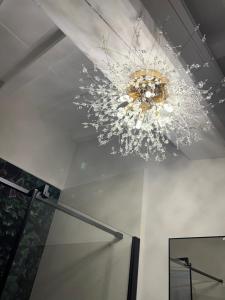 a chandelier hanging from a ceiling in a room at Joy home in Antella +71 photos