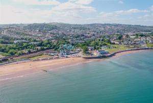 an aerial view of a beach and the ocean at The Goodrington Sands- Apart Hotel in Paignton