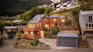 an aerial view of a house in a mountain at Majestic Waters in Queenstown