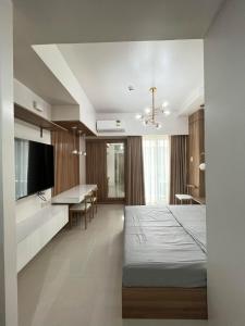 Ένα ή περισσότερα κρεβάτια σε δωμάτιο στο Inspiria Condo Davao next to Abreeza Ayala Mall +7 φωτογραφίες