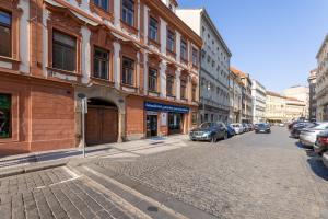 a city street with cars parked on the street at King's Royal Apartments in City Centre in Prague