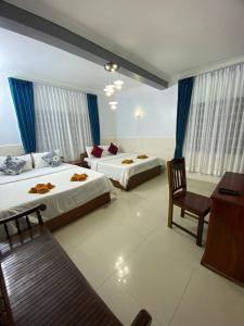Postel nebo postele na pokoji v ubytování Jasmine Lodge Siem Reap