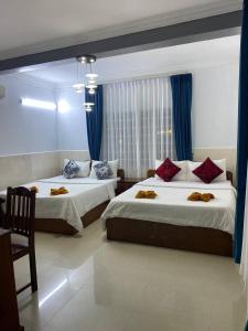 Postel nebo postele na pokoji v ubytování Jasmine Lodge Siem Reap