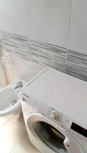 a white toilet with its seat up in a bathroom at Dolce Relax - Sottomarina in Sottomarina