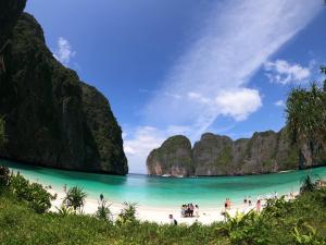 a group of people on a beach in coron palawan at Fora Boutique Hotel in Karon Beach
