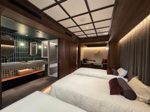Postel nebo postele na pokoji v ubytování Hotel Keihan Asakusa