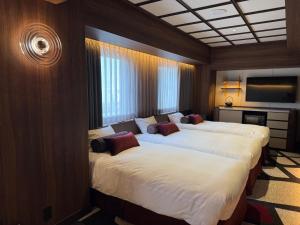 Postel nebo postele na pokoji v ubytování Hotel Keihan Asakusa