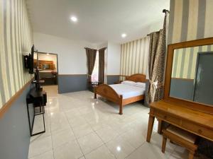 Μια τηλεόραση ή/και κέντρο ψυχαγωγίας στο Entire Home in West Lombok near Senggigi