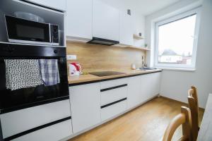 Kuchyň nebo kuchyňský kout v ubytování apartmány MAJKA