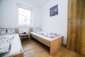 Postel nebo postele na pokoji v ubytování apartmány MAJKA