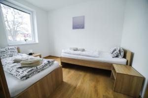 Postel nebo postele na pokoji v ubytování apartmány MAJKA