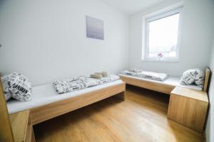 Postel nebo postele na pokoji v ubytování apartmány MAJKA