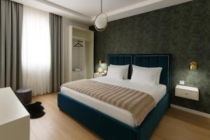 Postel nebo postele na pokoji v ubytování Hotel Capital Inn Tirana