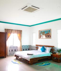 En eller flere senge i et værelse på Cy'Home Đà Nẵng