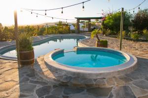a swimming pool in a stone patio with at Villa de La Rosa with Pool & BBQ Area Wine Country in San Pablo
