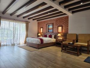 A bed or beds in a room at Manigram Bishram Batika Pvt Ltd