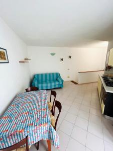a living room with a table and a couch at Ischia Casareccia in Serrara Fontana