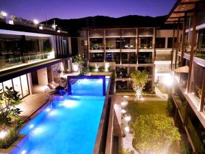 an overhead view of a swimming pool in a building at Kasa Verdana in Chiang Mai