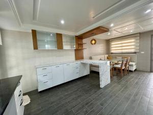 a kitchen with a table and a dining room at Folla in Nabeul