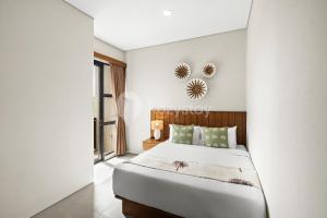 Una cama o camas en una habitación de Rein Villa by Kozystay - Jimbaran 36 fotos más