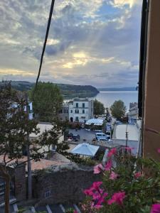a view of a town with a body of water at Light Blue in Anguillara Sabazia