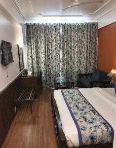 Postel nebo postele na pokoji v ubytování hotel Baljees Regency