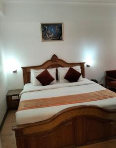 Postel nebo postele na pokoji v ubytování hotel Baljees Regency