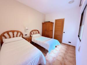 Postel nebo postele na pokoji v ubytování Hostal Castilla