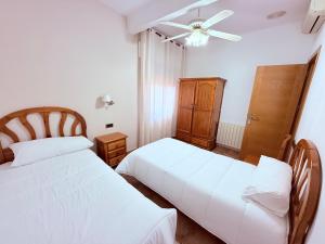 Postel nebo postele na pokoji v ubytování Hostal Castilla