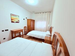 Postel nebo postele na pokoji v ubytování Hostal Castilla