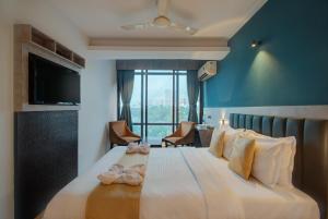 Postel nebo postele na pokoji v ubytování Hotel Time Square