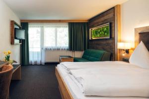 Postel nebo postele na pokoji v ubytování Hotel Barbara