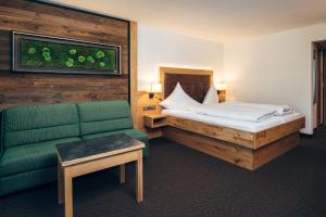 Postel nebo postele na pokoji v ubytování Hotel Barbara
