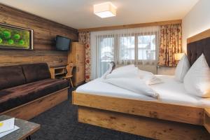 Postel nebo postele na pokoji v ubytování Hotel Barbara