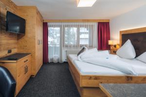Postel nebo postele na pokoji v ubytování Hotel Barbara